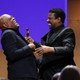 From left to right: Samuel L. Jackson, Samuel L. Jackson’s Oscar, Denzel Washington